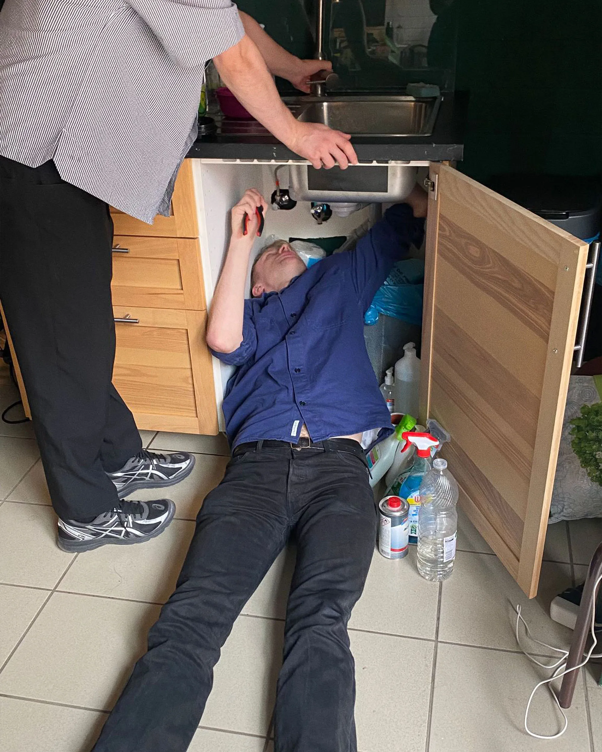SKIN Studio Team - Fixing the sink at the design studio