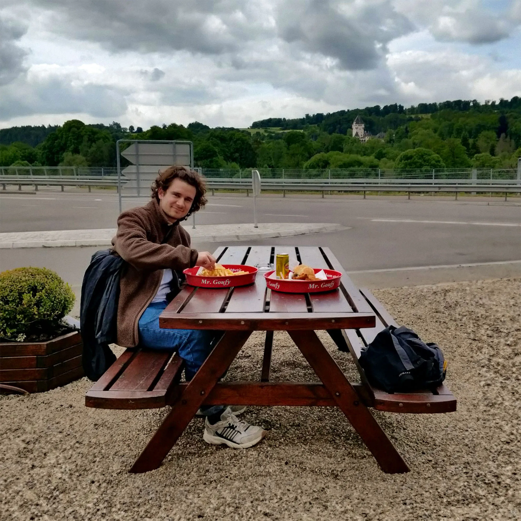 SKIN Studio Team - Tino having lunch on a bench